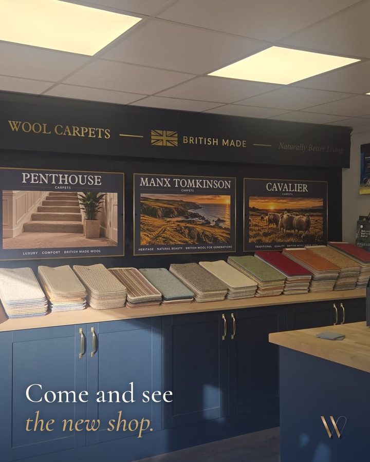 Wallace post: Come and see the new shop, over a photo of the wool carpet display.